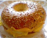 Eggs and cheese on sesame bagel