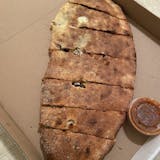 SAUSAGE PEPPERS & ONIONS CALZONE
