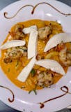 Gnocchi Topped With Fresh Mozzerella and Vodka Sauce with the choice of Chicken Or Shrimp