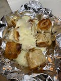 Garlic Knots topped with Mozzarella Cheese