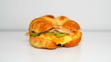 Croissant, Smoked Turkey, Avocado, Egg, & Cheddar Sandwich