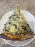 Chicken spinach Alfredo pizza slice