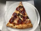 Meat lovers pizza slice