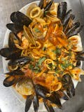 Zuppa di Pesce over linguine