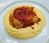 Stuffed calamari with seafood , served with polenta