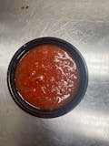 Cup of pizza sauce
