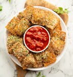 Fried Raviolis In Red Sauce