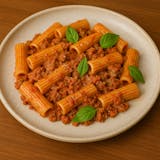 Rigatoni al pesto rosso and sausage meat