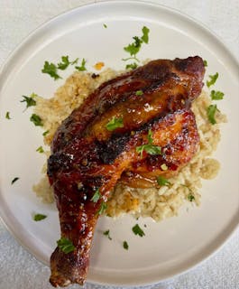 Roasted chicken over risotto