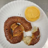 Soft Stuffed Pretzel with cheese sauce.