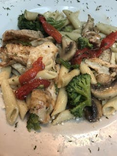 Chicken Parmigiana Over Pasta Dinner