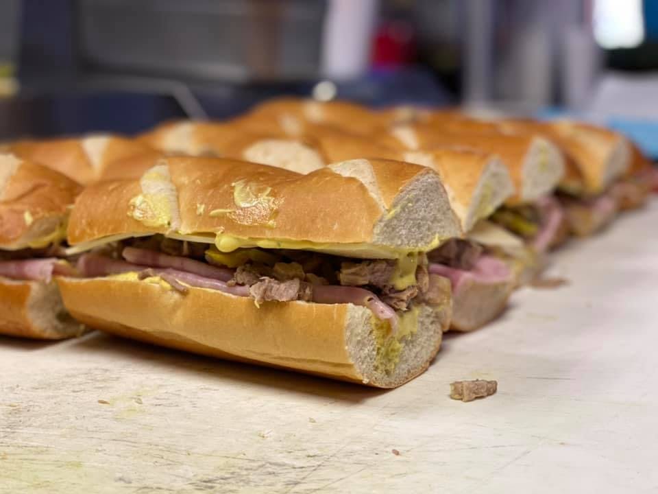 Order Ham & Cheese Sub - Large food online from Cap's Pizza store, Vero Beach on bringmethat.com