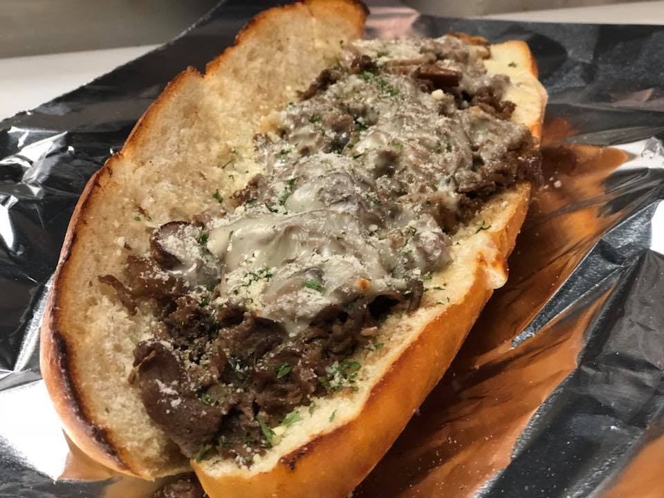 Order Philly Cheesesteak Sub - Large food online from Cap's Pizza store, Vero Beach on bringmethat.com