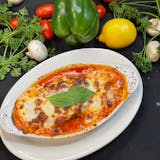 Lasagna (5-6 people), includes salad, bread, and choice of dessert.