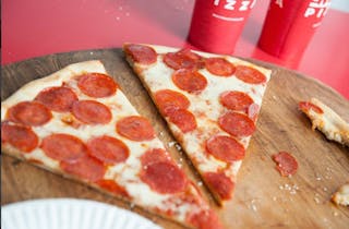 Crumble Sausage, Pepperoni & Bacon Pizza Slice