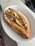 Cheesesteak with French fries.