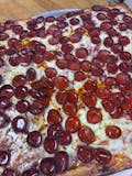Sicilian Cup & Char Pepperoni Drizzled with Hot Honey Pizza Slice
