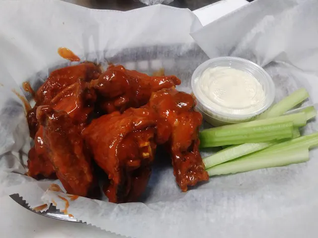 Buffalo wings served with blue cheese