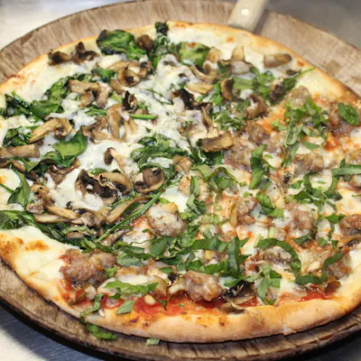 Salsiccia Pizza — Italian sausage, mushrooms, Gorgonzola, mozzarella, basil, and pine nuts