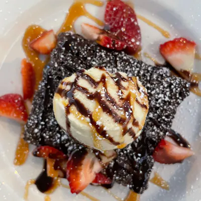 Triple Fudge Brownies served with vanilla ice cream