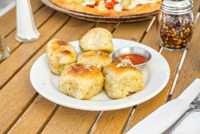 Garlic Knots — pizza dough knots baked with butter, garlic and parsley