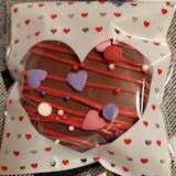 Chocolate covered oreo in decorative heart framed bag