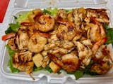 Chicken & Shrimp over Caesar Salad