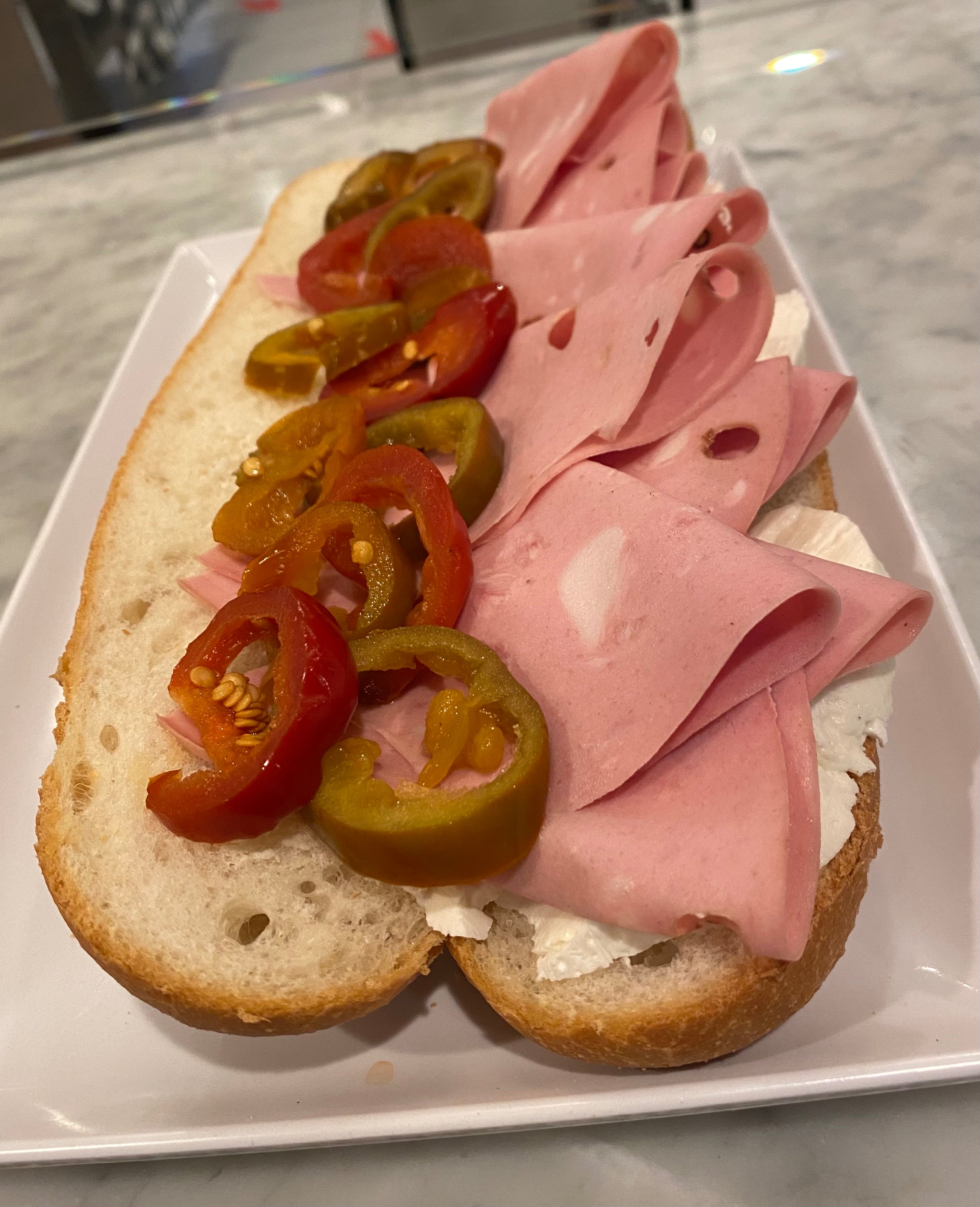 Order Mortadella, Mozzarella and Hot Peppers - Hard Roll food online from Italian Corner Deli By Massimo store, Trumbull on bringmethat.com