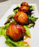 Scallops wrapped with bacon