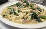 cavatelli with cannellini beans and baby spinach in a garlic sauce