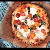 White pizza with fresh cherry tomatoes