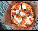 White pizza with fresh cherry tomatoes