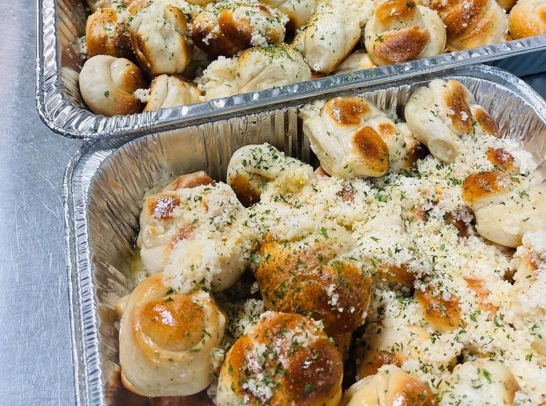Order Homemade Garlic Knots - 6 Pieces food online from Goodfella's Pizza store, Jupiter on bringmethat.com