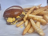 Cheese Steak prezel buns cheddar cheeses on pretzel buns we fries