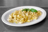 Homemade fettuccine pasta with white sauce