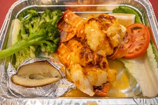 Twin Lobster Tail Served with Clarified Butter & Vegetables