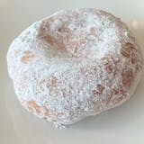 Raised donut, custard filled with powdered sugar ( creamy yellow custard)
