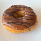 Caramel icing, chocolate drizzled raised donut