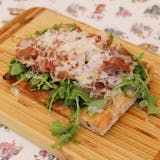 Arugula & Prosciutto Pizza Slice