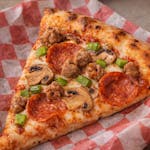 Neapolitan Four Toppings Pizza Slice