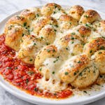 11. Garlic Knots with Sauce & Melted Mozzarella Cheese 