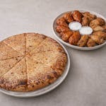 #2. One Large Pizza with One Topping, 20 Wings (Plain or Sauced) - Special